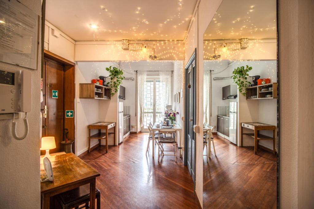 a living room with a table and a dining room at Circus Maximus B&B in Rome