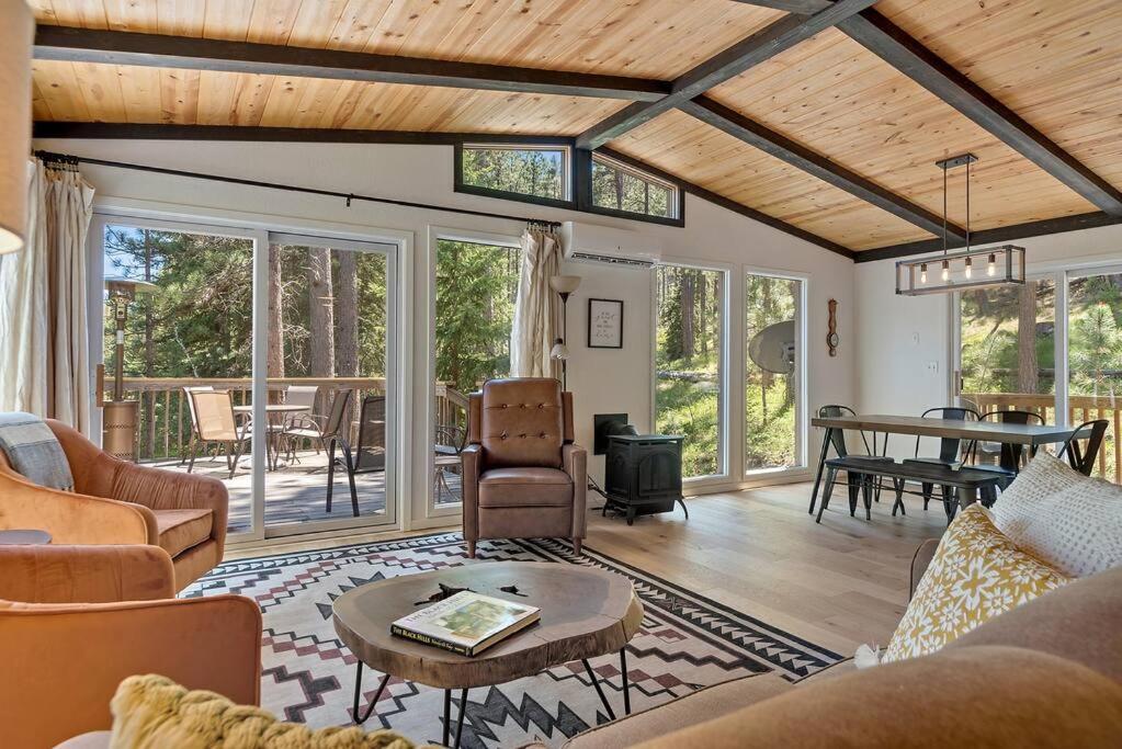 a living room with couches and a table at Nature Stay with Views Like No Where Else in Custer