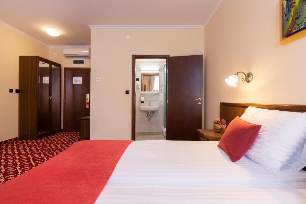 Postel nebo postele na pokoji v ubytování Hotel Continental