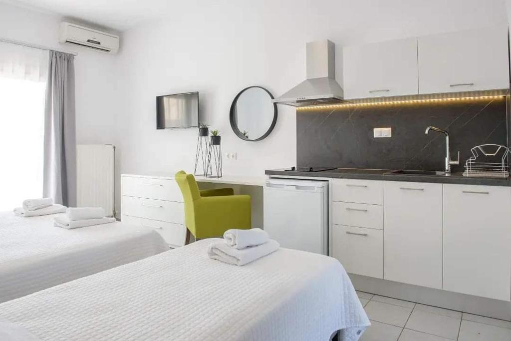 Postel nebo postele na pokoji v ubytování Hotel Papanikolaou