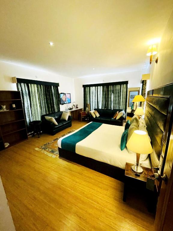 Postel nebo postele na pokoji v ubytování Gomang Boutique Hotel