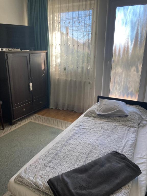 Postel nebo postele na pokoji v ubytování Apartman-Donau Tát