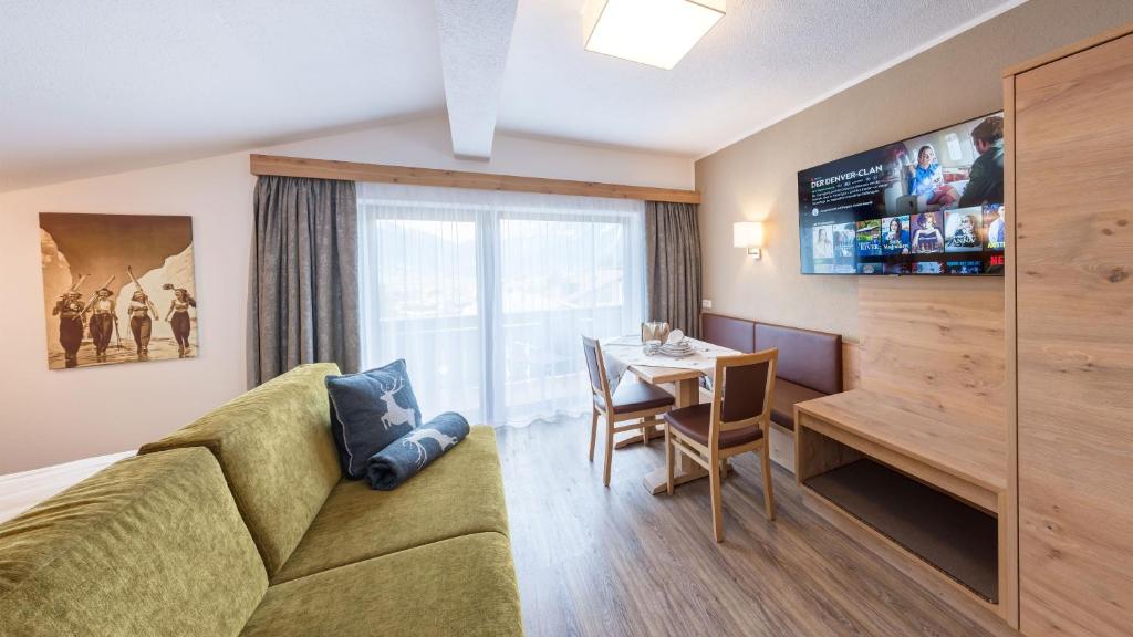 A television and/or entertainment centre at BIRKENHOF premium apart & suites