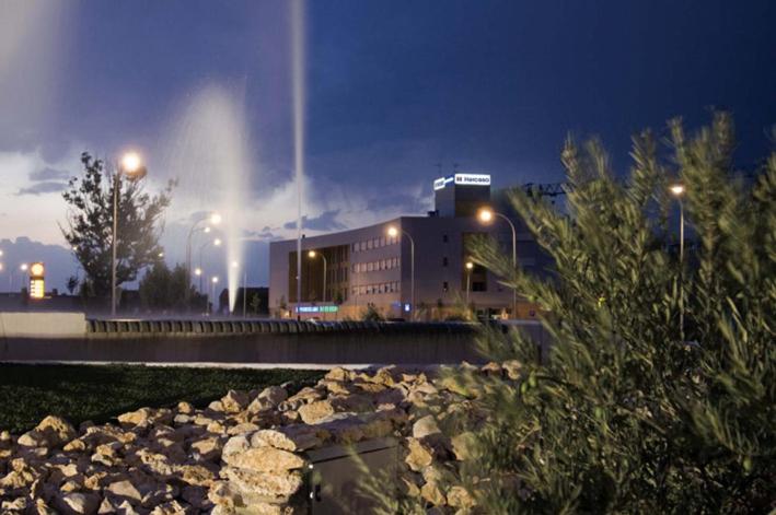 a large building with a fountain in front of it at AT home Señorio de Molina in Guadalajara