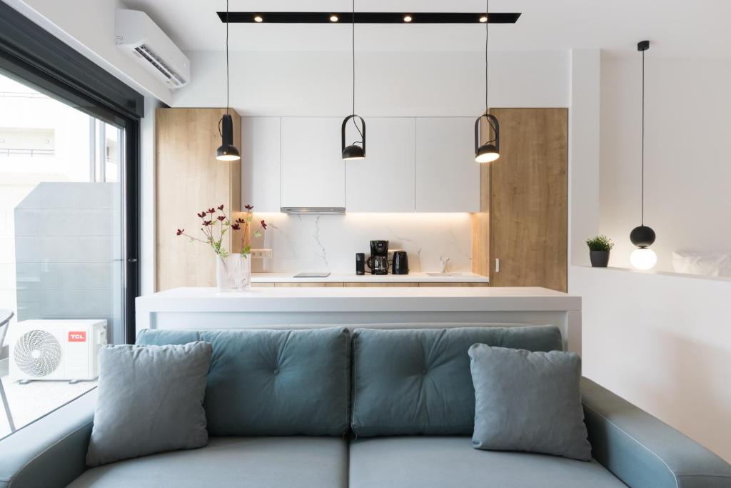 a living room with a couch and a kitchen at Voda Luxury Residence #401 in Athens