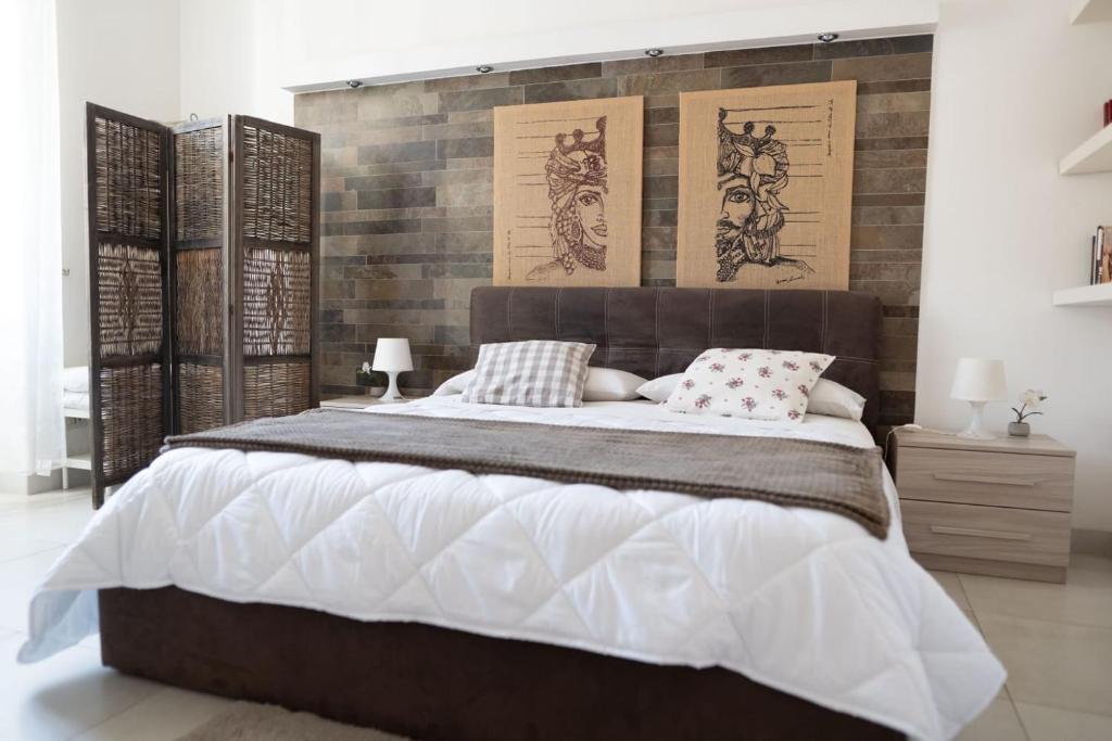 Säng eller sängar i ett rum på Casa Andromaca