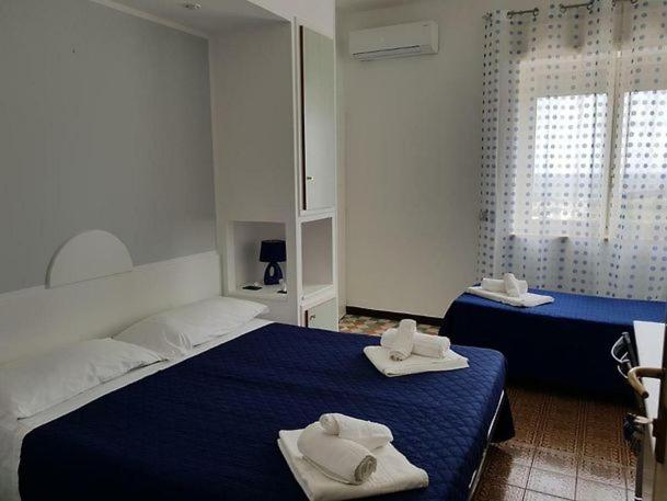 Postel nebo postele na pokoji v ubytování Hotel La Plancia