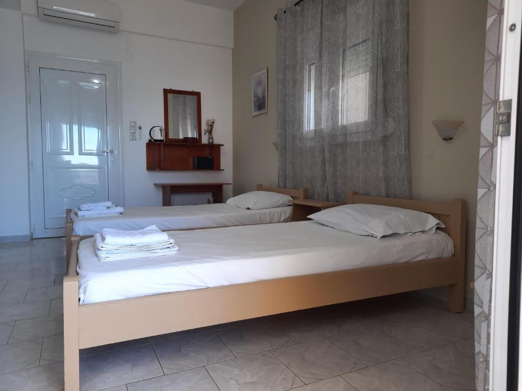 Postel nebo postele na pokoji v ubytování Voula Beach