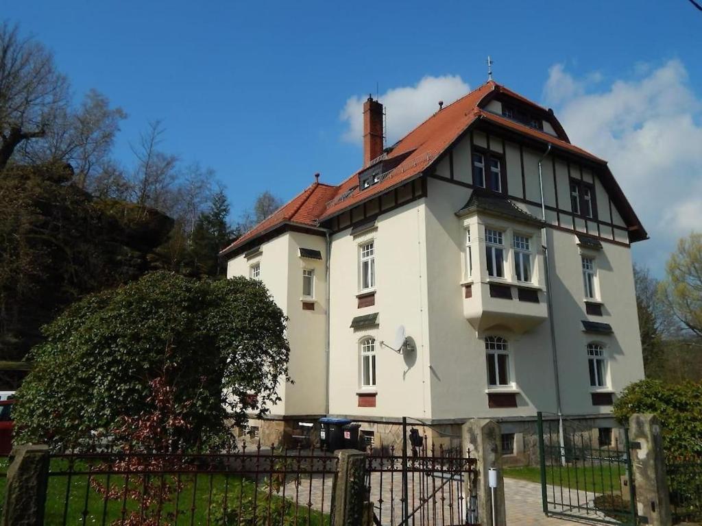 a large white house with a red roof at Jugendstilvilla Rosenthal in Rosenthal