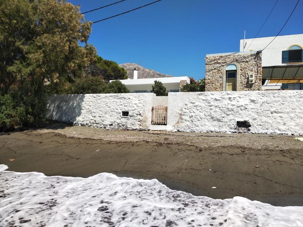 a pile of snow in front of a house at VILLA KANTOUNI ON THE BEACH in Panormos Kalymnos