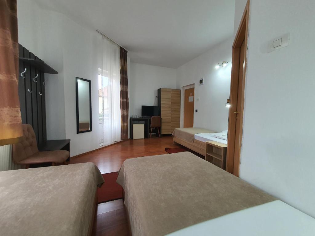 Postel nebo postele na pokoji v ubytování Hotel Mures