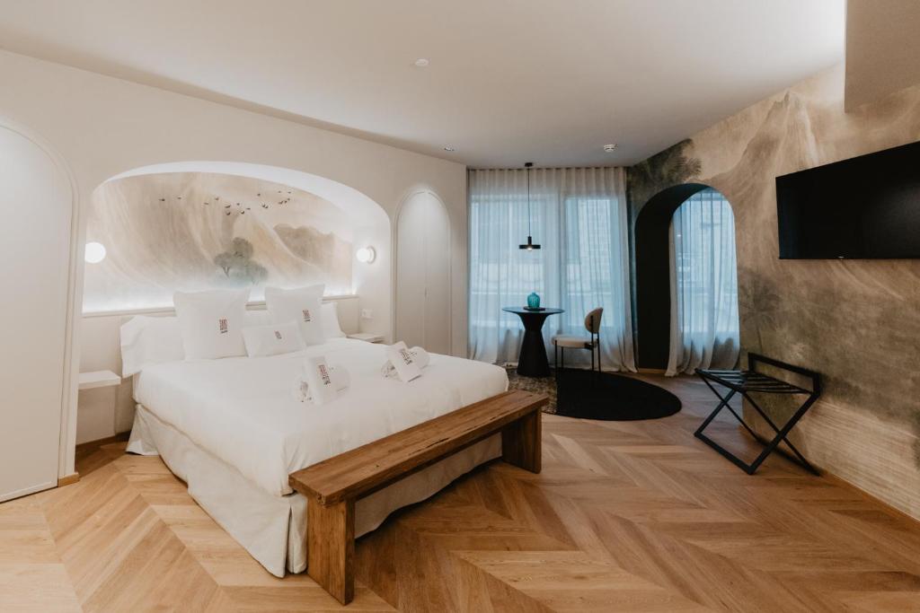 Posteľ alebo postele v izbe v ubytovaní Hotel Petit Luxe