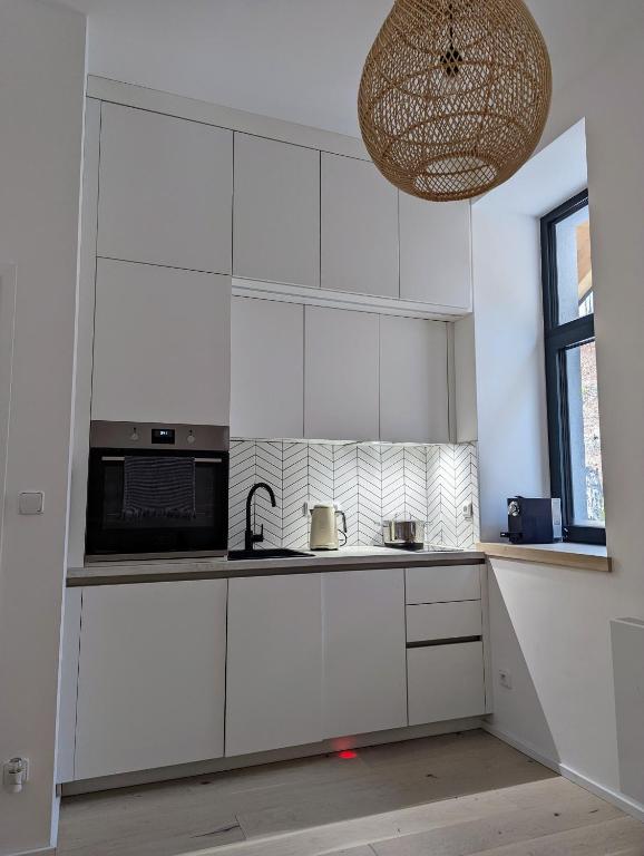 Kuchyň nebo kuchyňský kout v ubytování JASMIN HOME Apartments