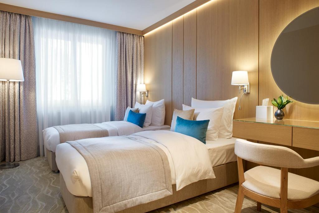 Llit o llits en una habitació de Normafa Hotel