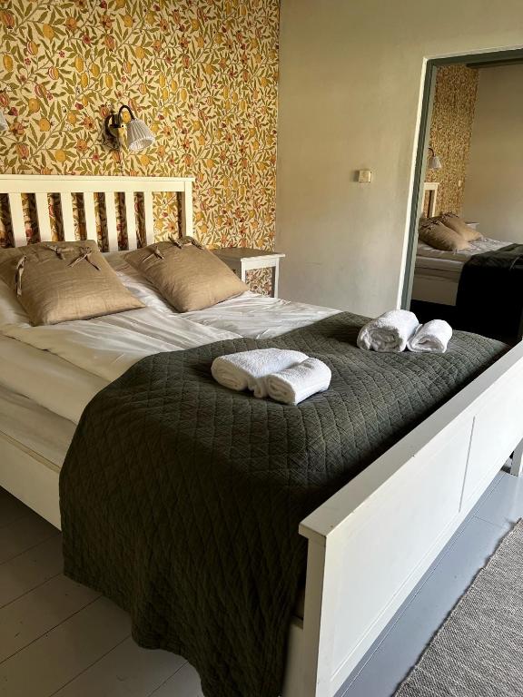 Postel nebo postele na pokoji v ubytování Svabesholms Kungsgårds B&B och Pensionat Stenshuvud