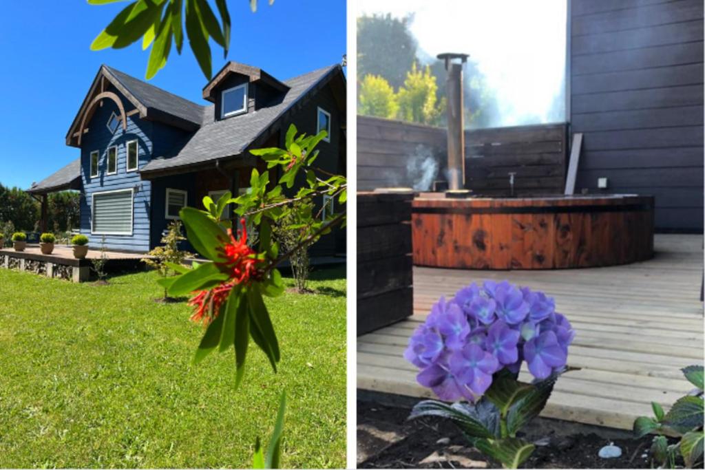 ein Haus und ein Garten mit Blumen im Hof in der Unterkunft Stay Casa Hotel in Puerto Varas