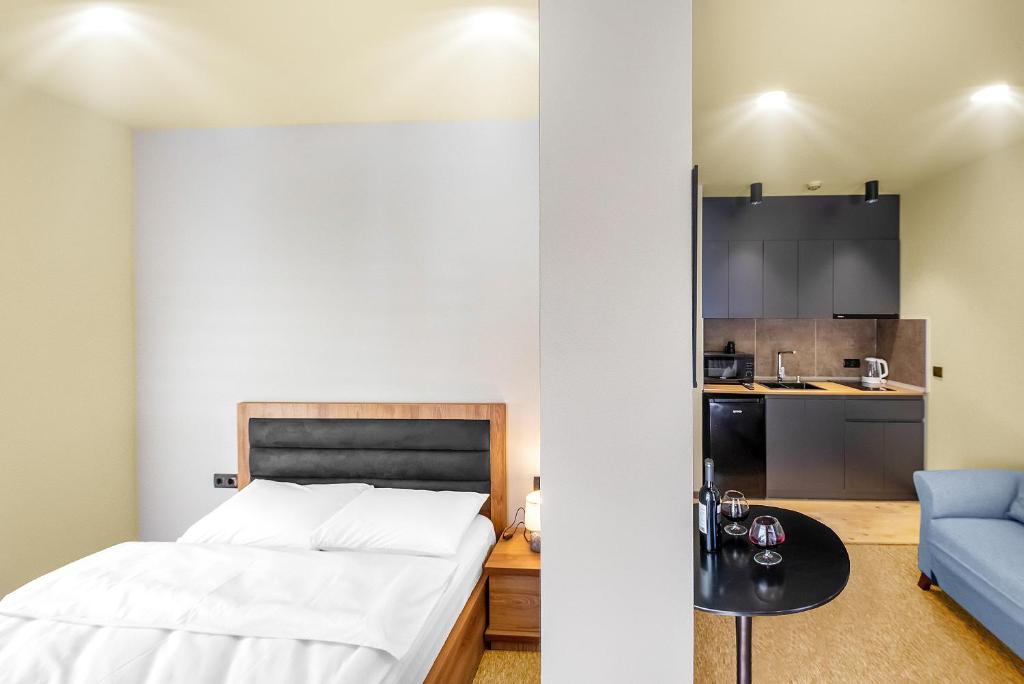 Postel nebo postele na pokoji v ubytování LALO Hotel Abastumani