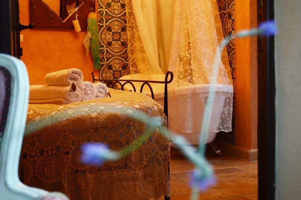 Postel nebo postele na pokoji v ubytování Atelier Luxury Rooms