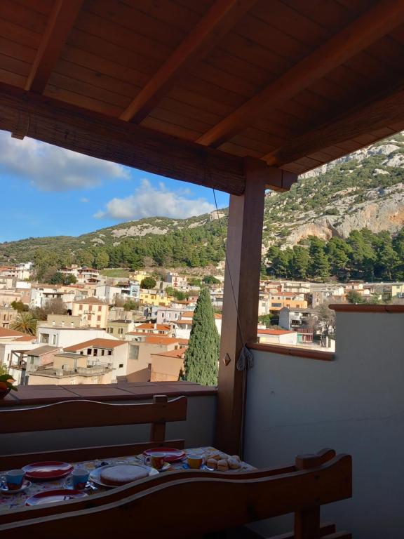 a view of a city from a bedroom window at AFFITTACAMERE DORGALI B&B da ZIETTO in Dorgali