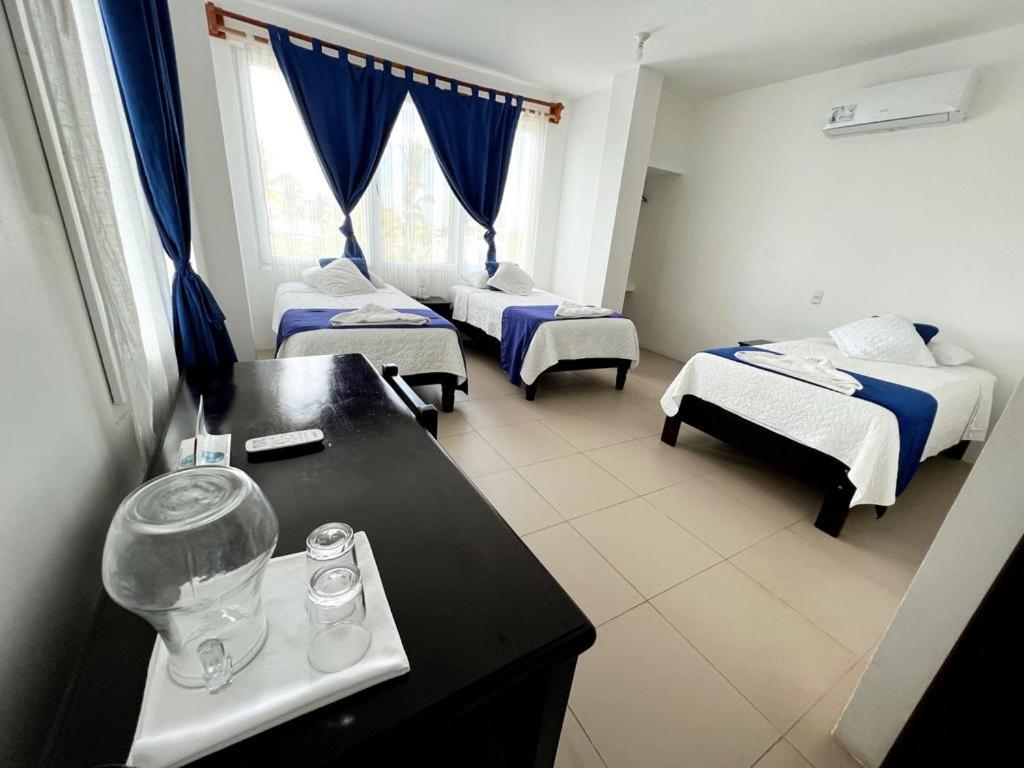 Postel nebo postele na pokoji v ubytování Hotel Cally