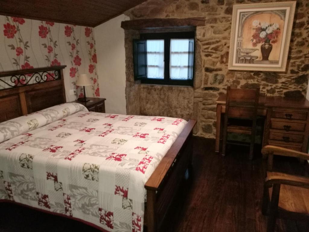 Postel nebo postele na pokoji v ubytování Casa de los Somoza