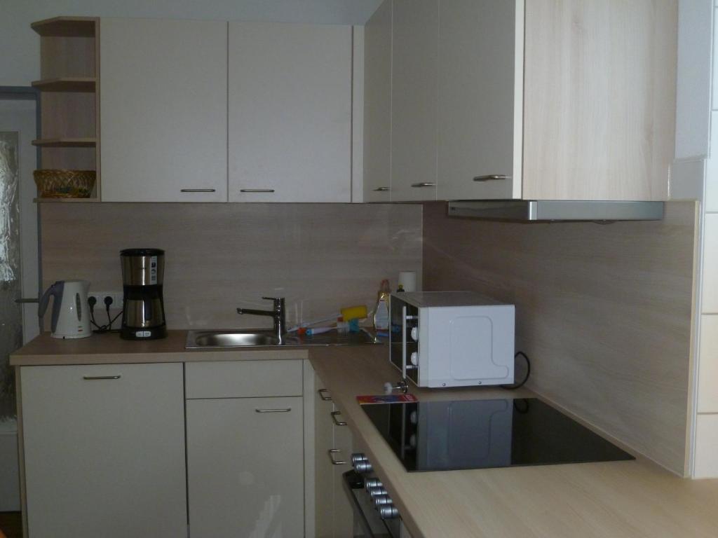 Kuchyň nebo kuchyňský kout v ubytování Haus Seestern