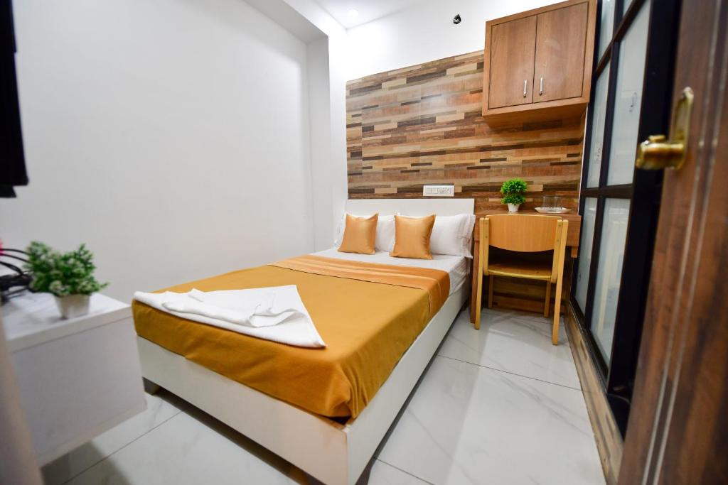 Postel nebo postele na pokoji v ubytování Hotel Surya Lodge