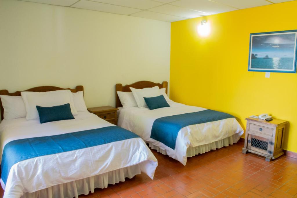Voodi või voodid majutusasutuse Ecohotel La Casona Pereira toas