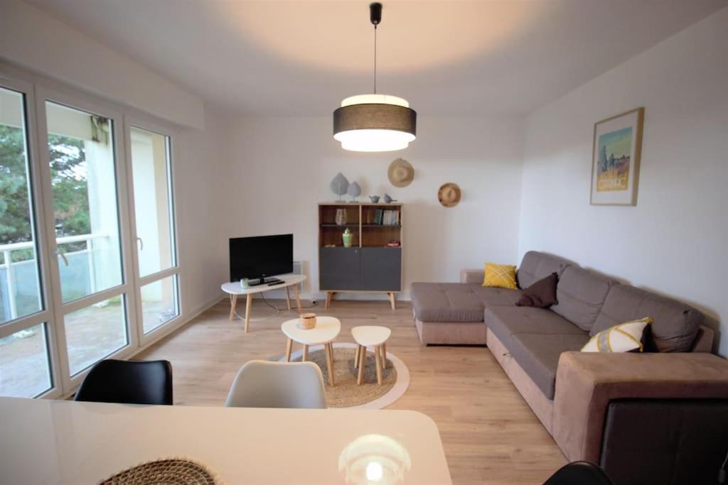 a living room with a couch and a table at Stella maris in Carnac