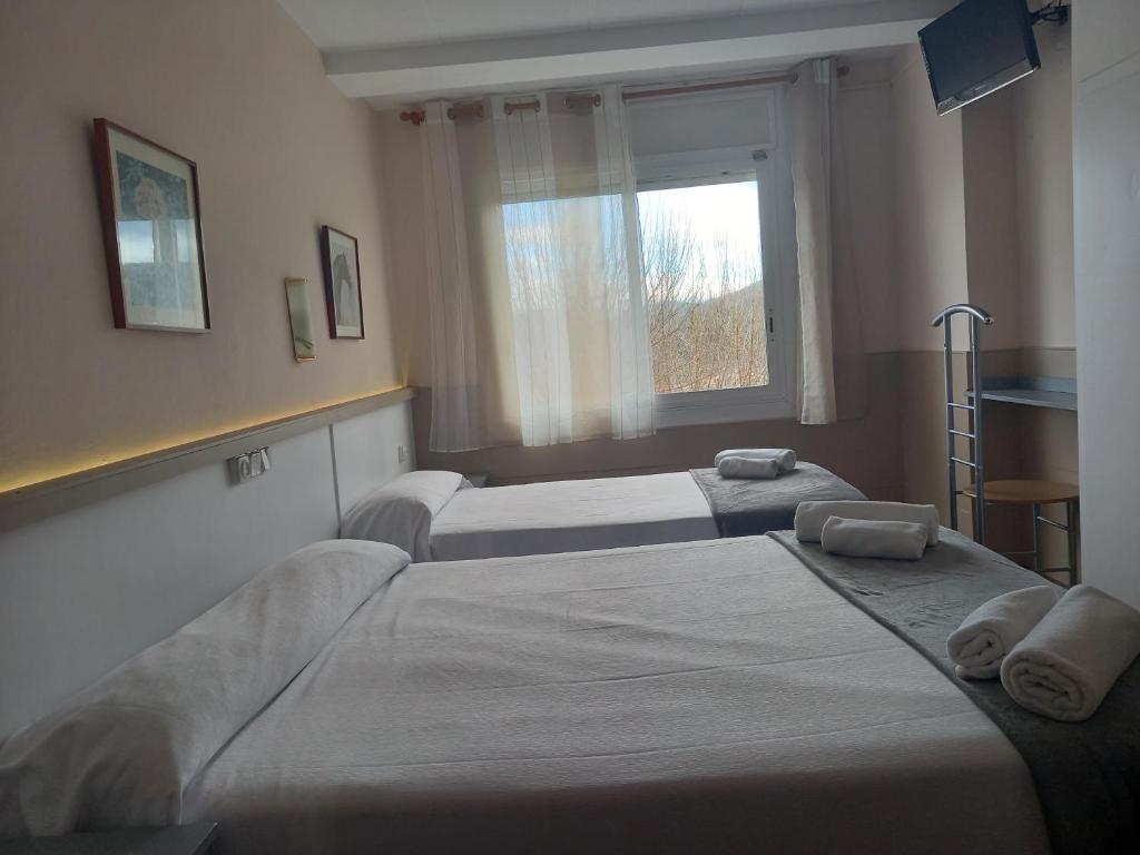 Postel nebo postele na pokoji v ubytování Hostal Sant Bernat