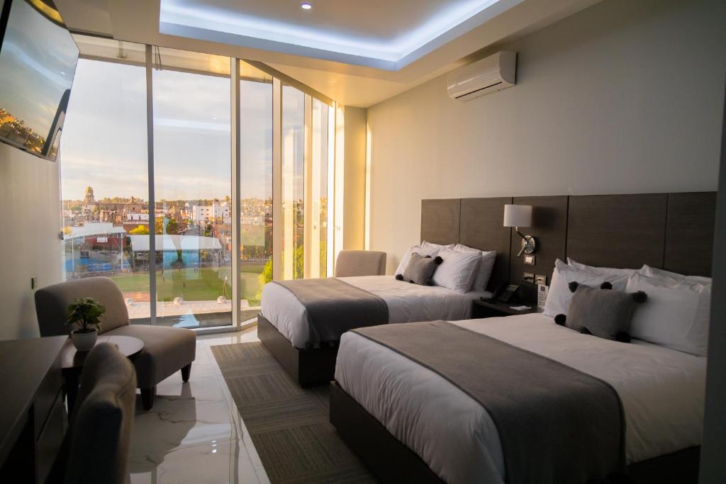 Postel nebo postele na pokoji v ubytování Hotel GRALTA