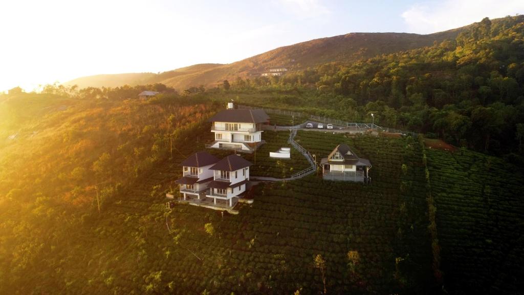 an aerial view of a house on a hill at 10 Degrees North By Avni Holidays in Idukki