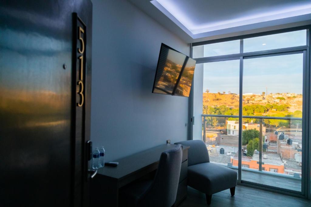TV a/nebo společenská místnost v ubytování Hotel GRALTA