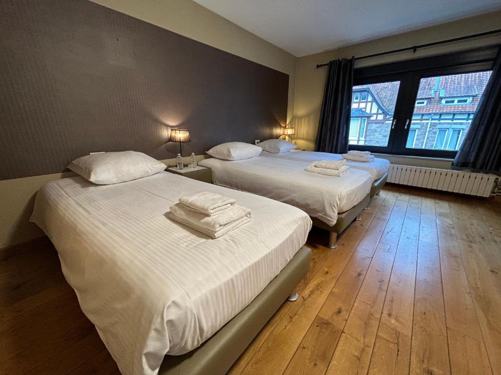 Postel nebo postele na pokoji v ubytování Race & Rooms