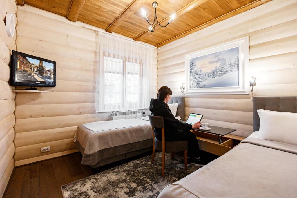 Postel nebo postele na pokoji v ubytování Korona Hotel&SPA