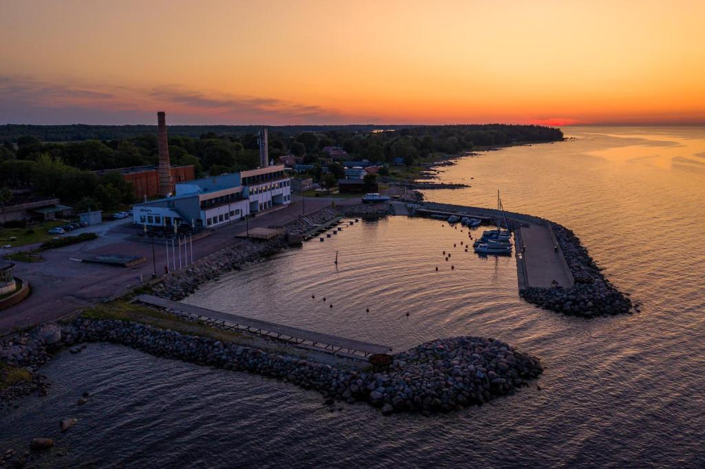an aerial view of a body of water at sunset at Viinistu Art Hotel in Viinistu