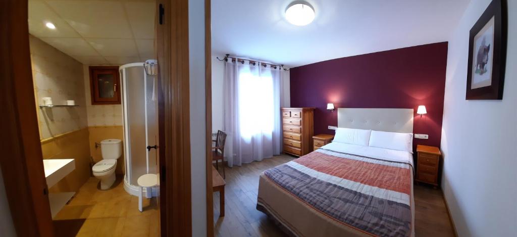 Postel nebo postele na pokoji v ubytování Hotel Casa Escolano