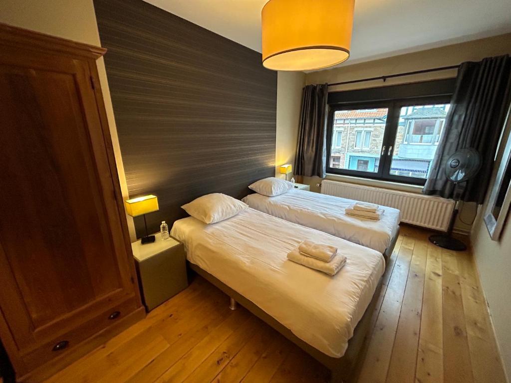 Postel nebo postele na pokoji v ubytování Race & Rooms