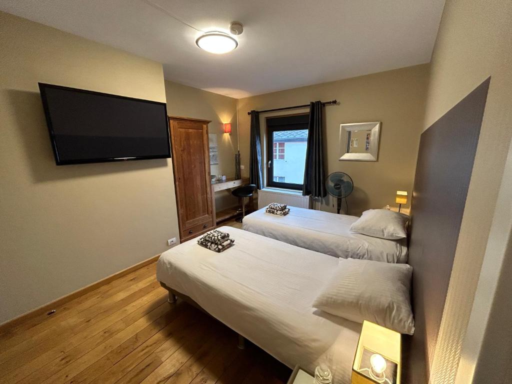 Postel nebo postele na pokoji v ubytování Race & Rooms