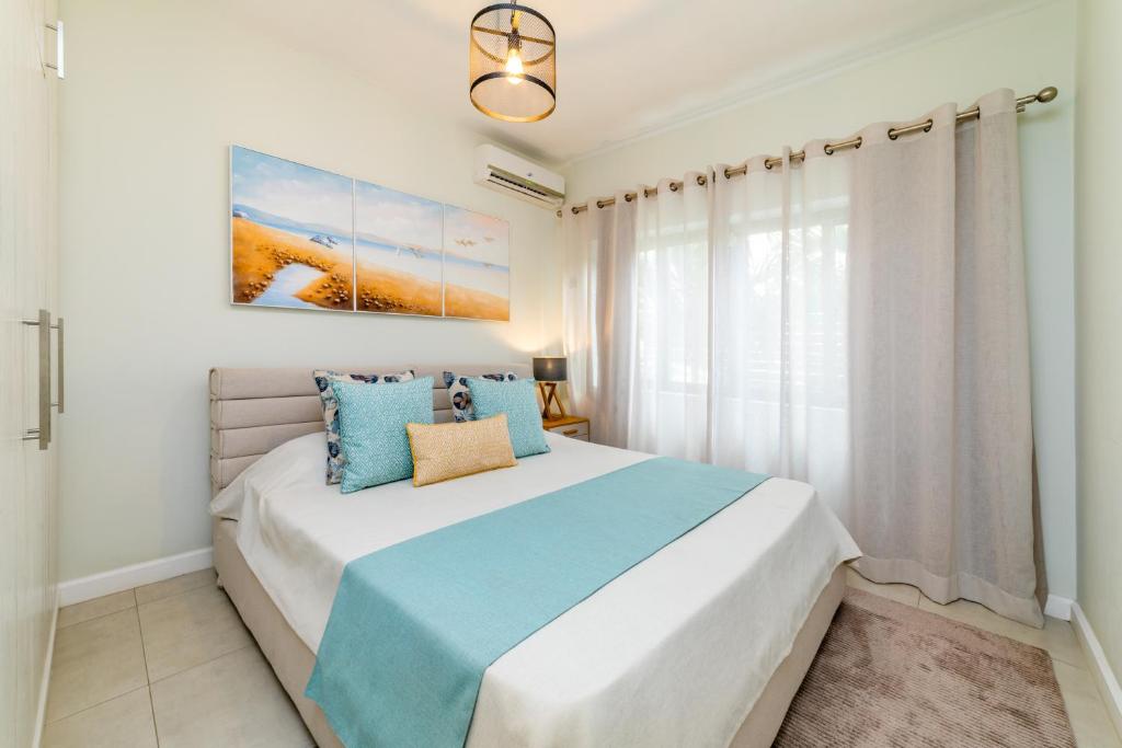 Postel nebo postele na pokoji v ubytování Beachcove Apt No 1