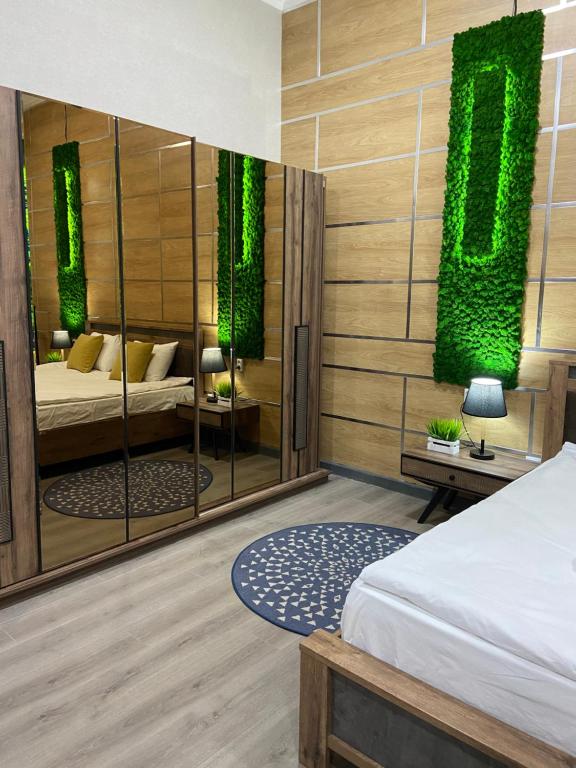 Postel nebo postele na pokoji v ubytování Inter Hotel Bishkek