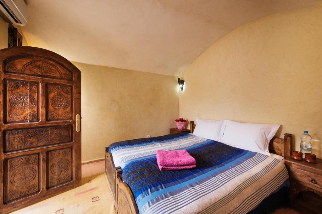 Postel nebo postele na pokoji v ubytování Imlil Lodge