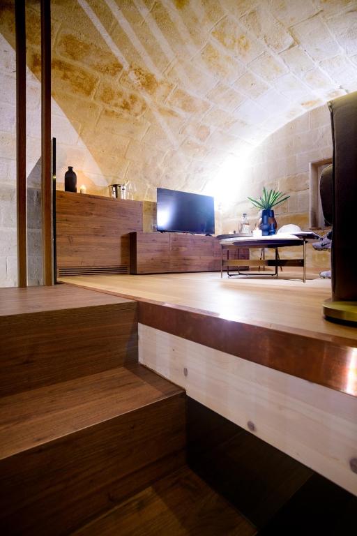 TV a/nebo společenská místnost v ubytování Le Malve Cave Retreat