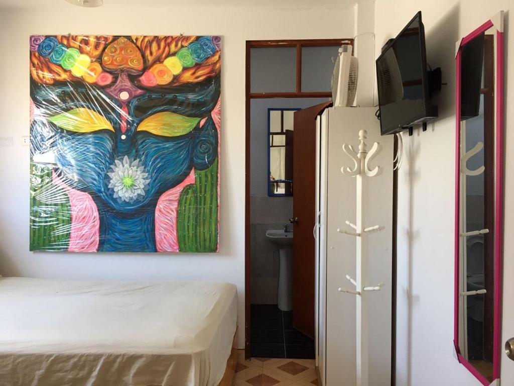 Postel nebo postele na pokoji v ubytování Hospedaje Los Lobos