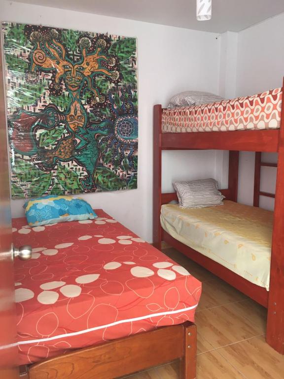 Postel nebo postele na pokoji v ubytování Hospedaje Los Lobos