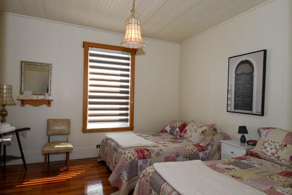 Postel nebo postele na pokoji v ubytování Maison de Percé
