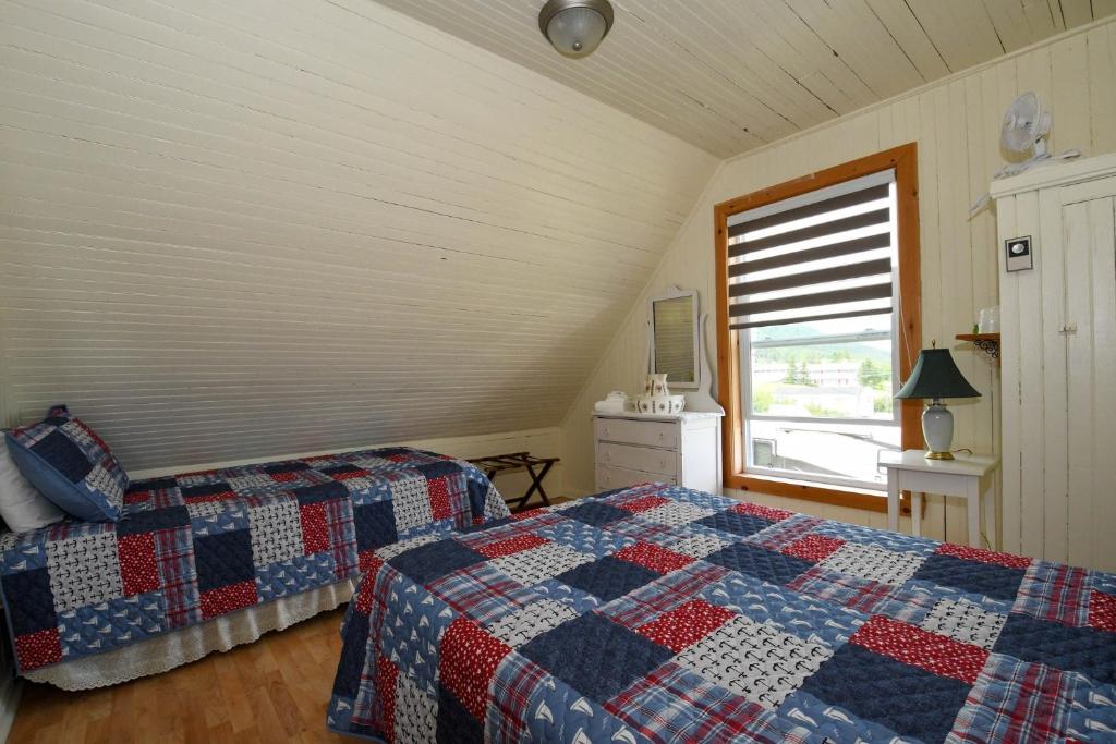 Postel nebo postele na pokoji v ubytování Maison de Percé