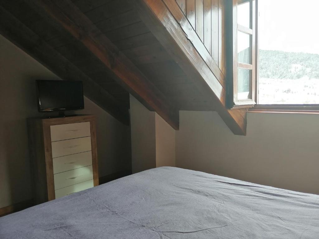Posteľ alebo postele v izbe v ubytovaní Precioso triplex con jardín y Wifi Puig Falcó 1