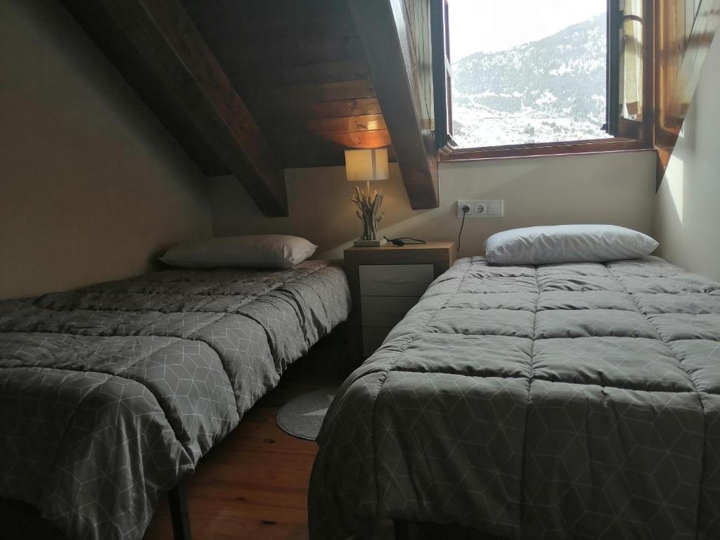 Posteľ alebo postele v izbe v ubytovaní Precioso triplex con jardín y Wifi Puig Falcó 1