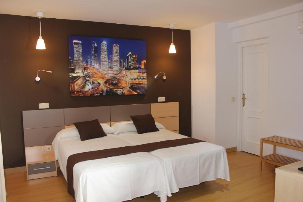 Cama o camas de una habitación en Hostal Falfes